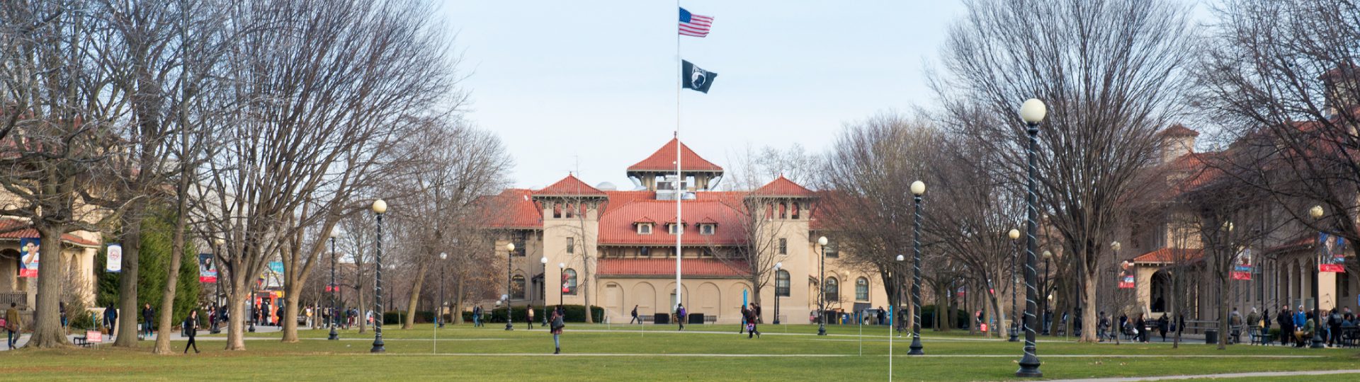 The Queens College quad with Jefferson Hall and students in view.